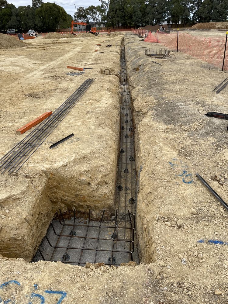 Steel-reinforced strip footing in an excavated trench on a local government civil works site